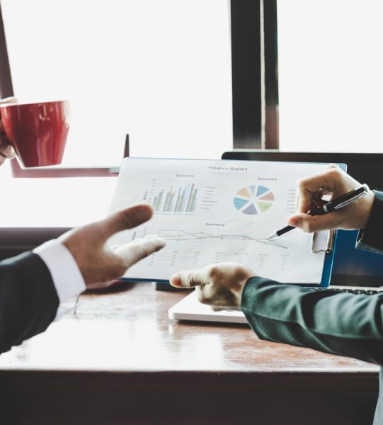 Business team analyzing income charts and graphs. Close up. Business analysis and strategy concept.